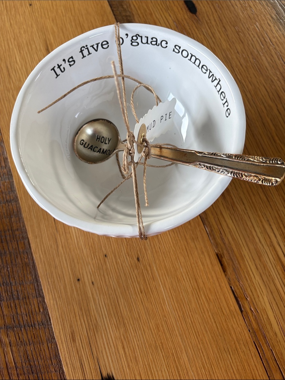 Mud Pie White Ceramic Guacamole Bowl with Playful Script and spoon.